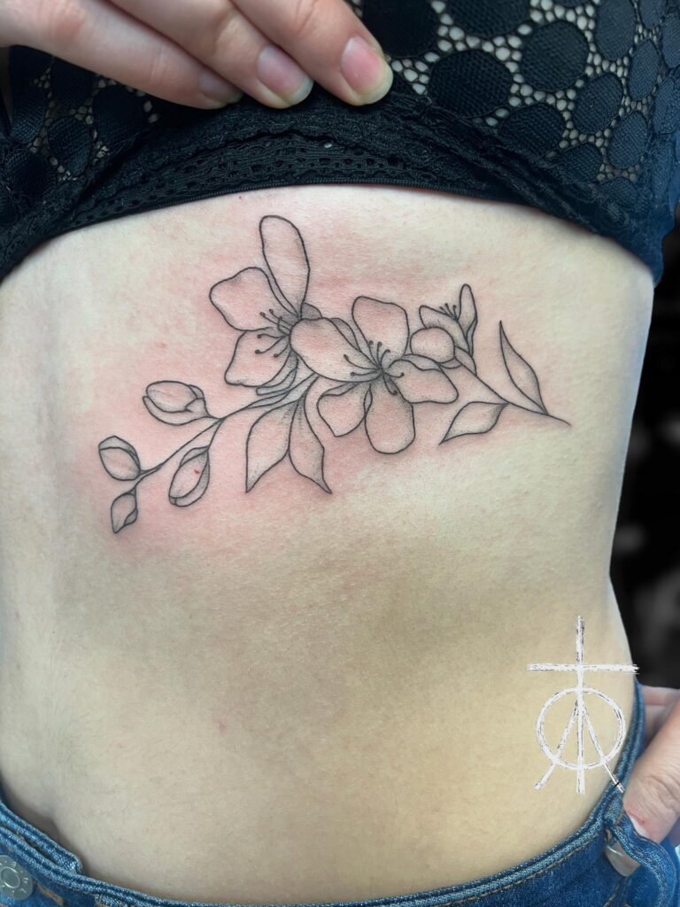 Floral Tattoo, Feminine Tattoo, Rib Tattoo, Fine Line Tattoo by Claudia Fedorovici, the Best Tattoo Artist Amsterdam