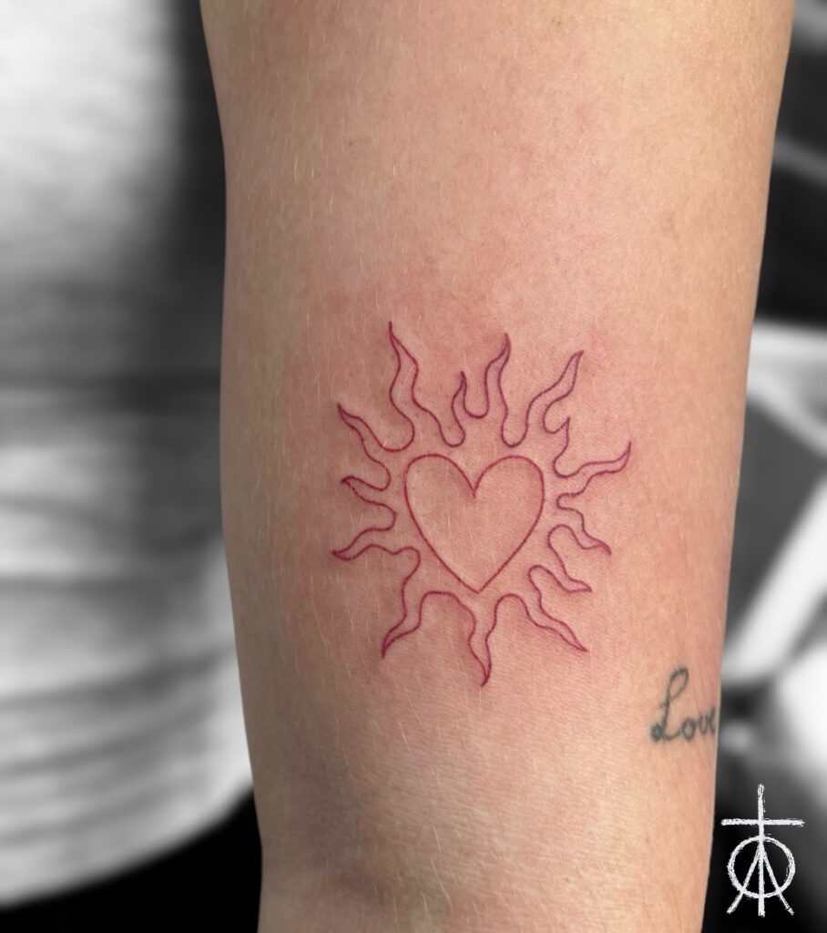 Red Ink Fine Line Sun Tattoo by The Best Artist Claudia Fedorovici
