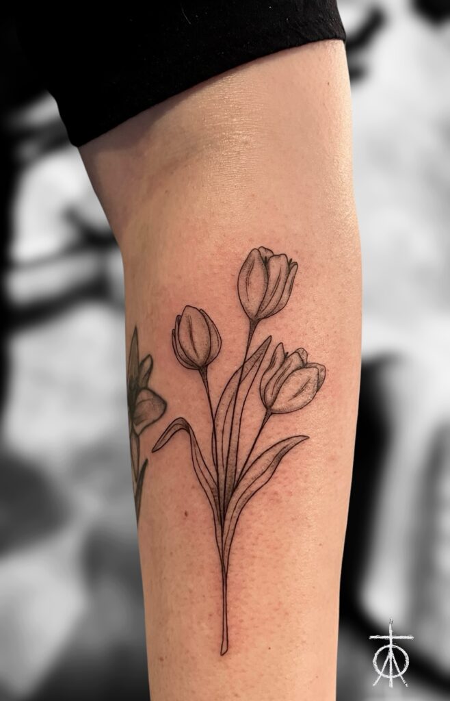 The Best Fine Line Tulips Tattoo done in Amsterdam by Claudia Fedorovici