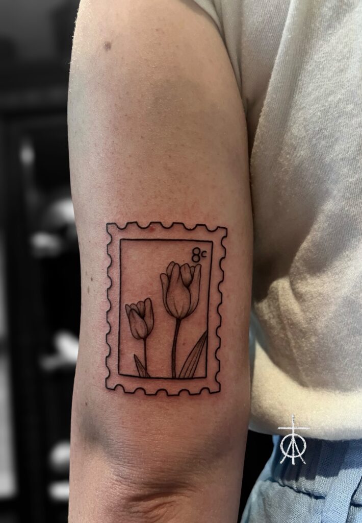 The Best Fine Line Tattoo done by Claudia Fedorovici , Tulips Stamp Tattoo , Amsterdam Tattoo